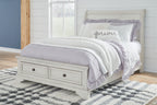 White sleigh bed with two storage drawers and paneled headboard