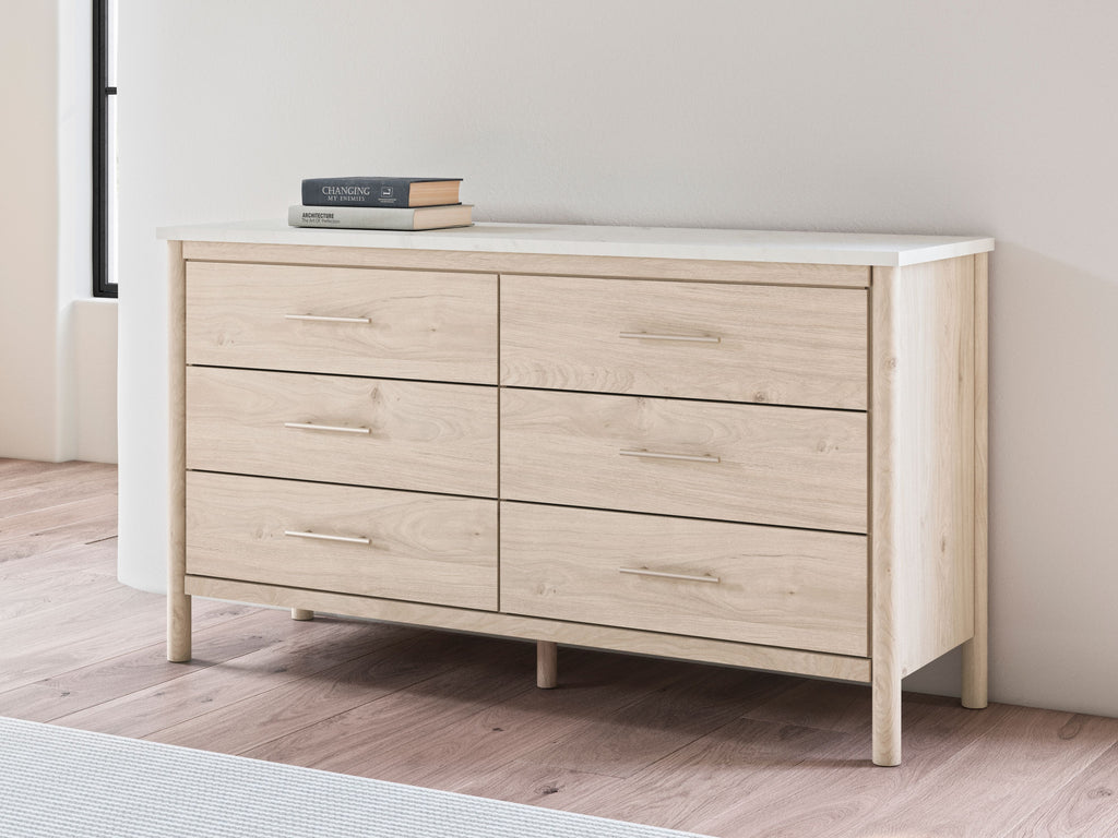 Light wood six-drawer dresser with top drawers visible and bar pulls