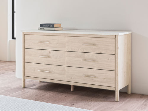 Light wood six-drawer dresser with top drawers visible and bar pulls
