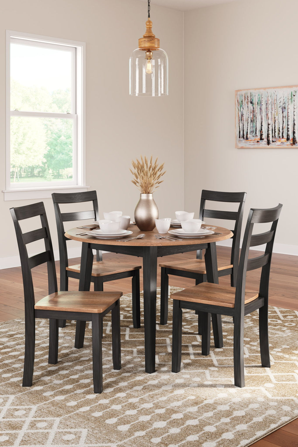 5-piece round dining set with dark chairs and round table in a bright room