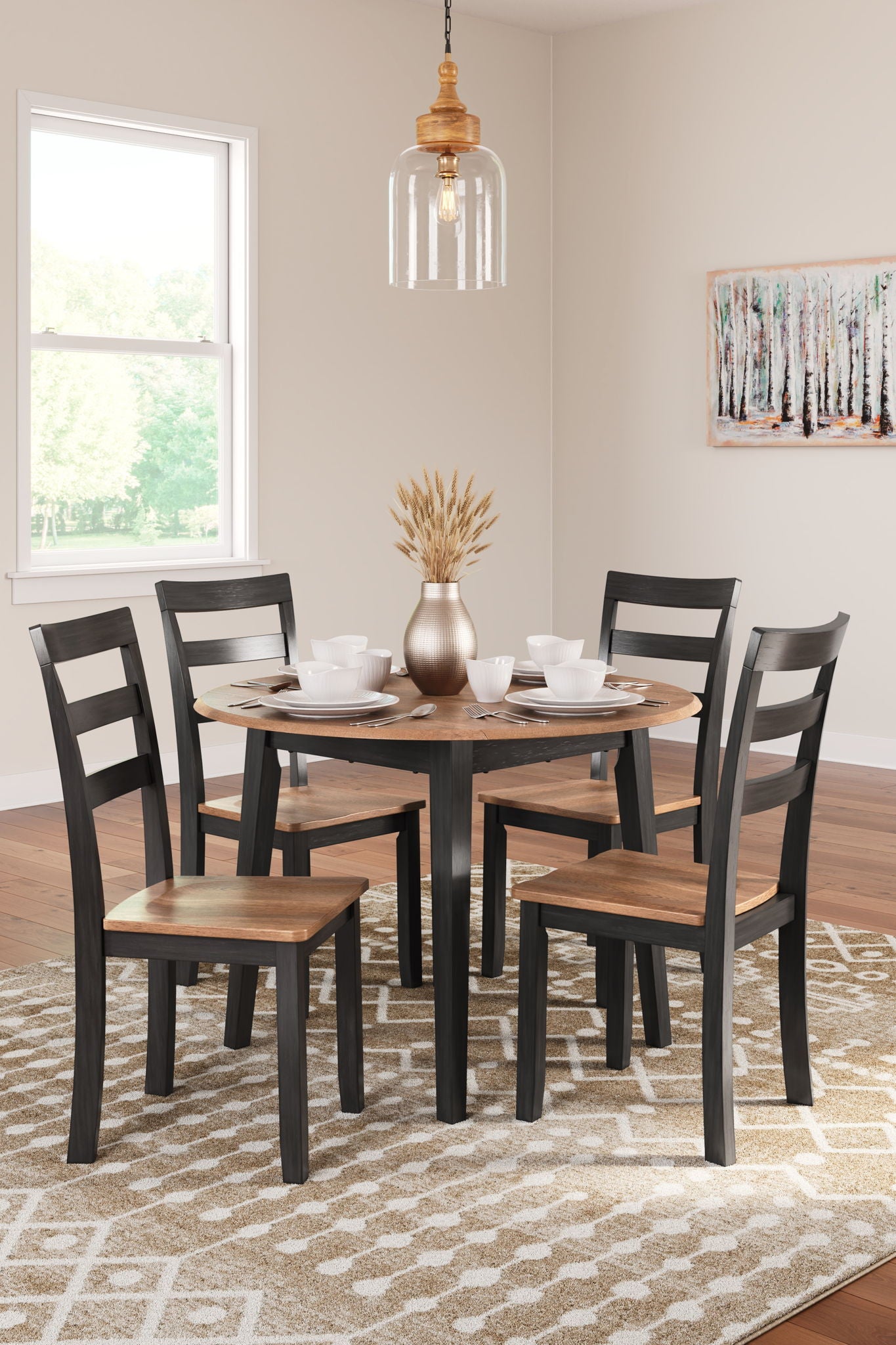 5-piece round dining set with dark chairs and round table in a bright room