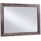 Gray wood bedroom mirror with rectangular frame and beveled edges
