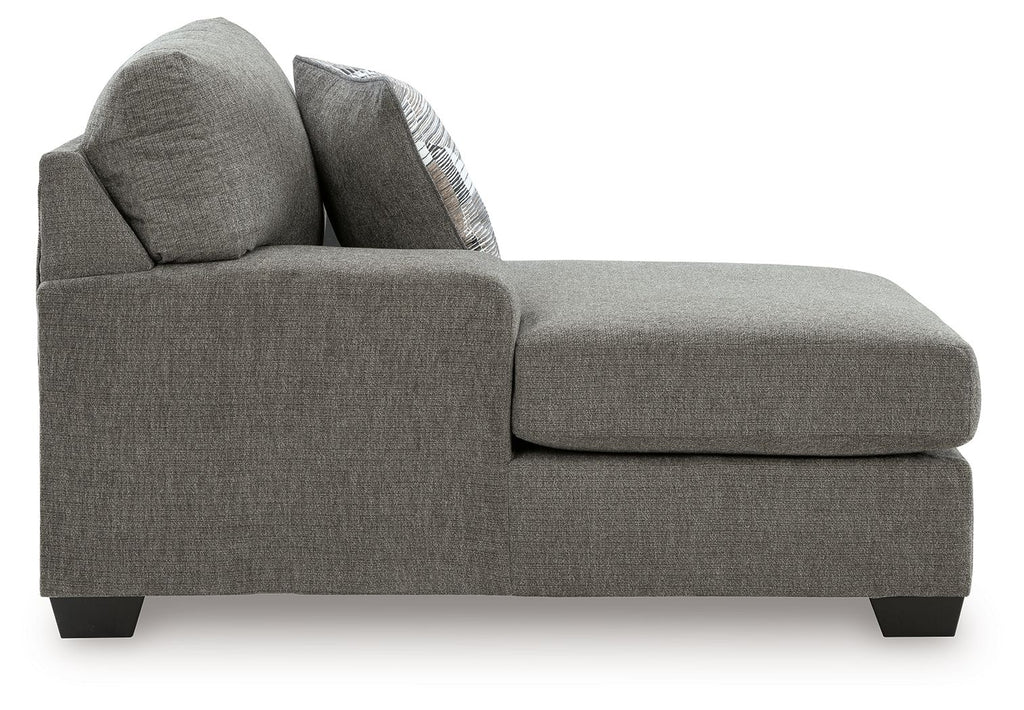 Gray corner chaise with squared arms, thick seat cushion, and two accent pillows