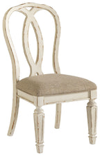 Upholstered dining side chair with carved ribbon-style back, beige seat, white frame