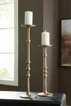 Antique brass candle holder set with two tall stands and white pillar candles