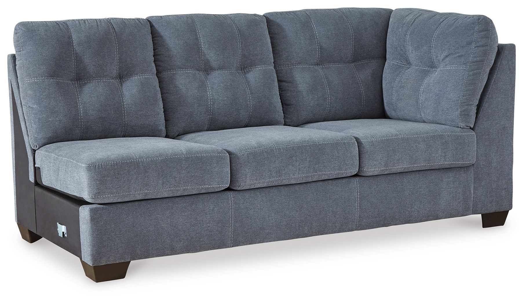 Denim-blue upholstered sofa with tufted back and split seat cushions, wooden legs