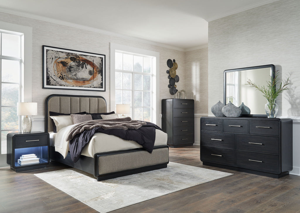 Black bedroom set with bed frame, dresser, mirror, and nightstand