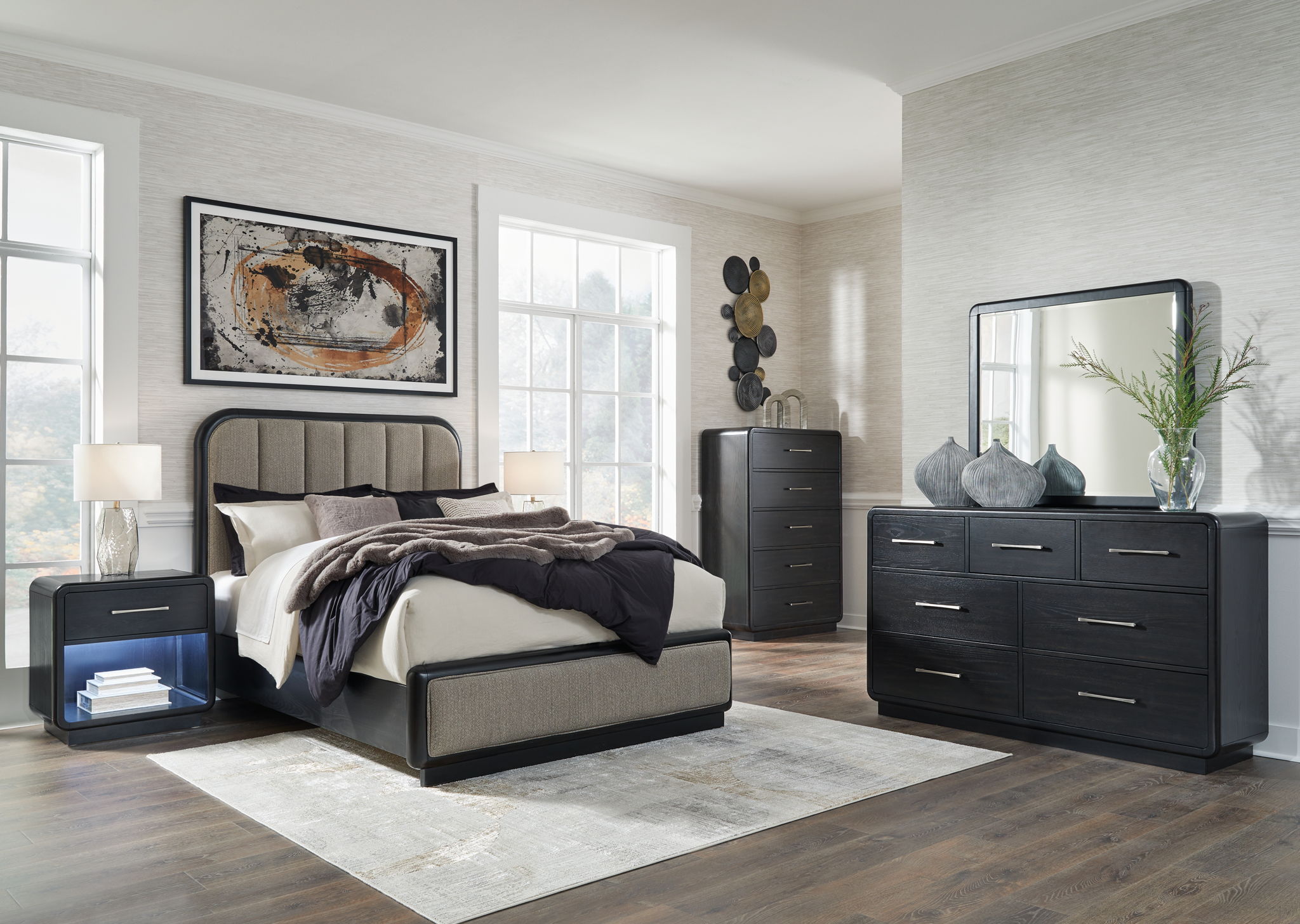 Black bedroom set with bed frame, dresser, mirror, and nightstand