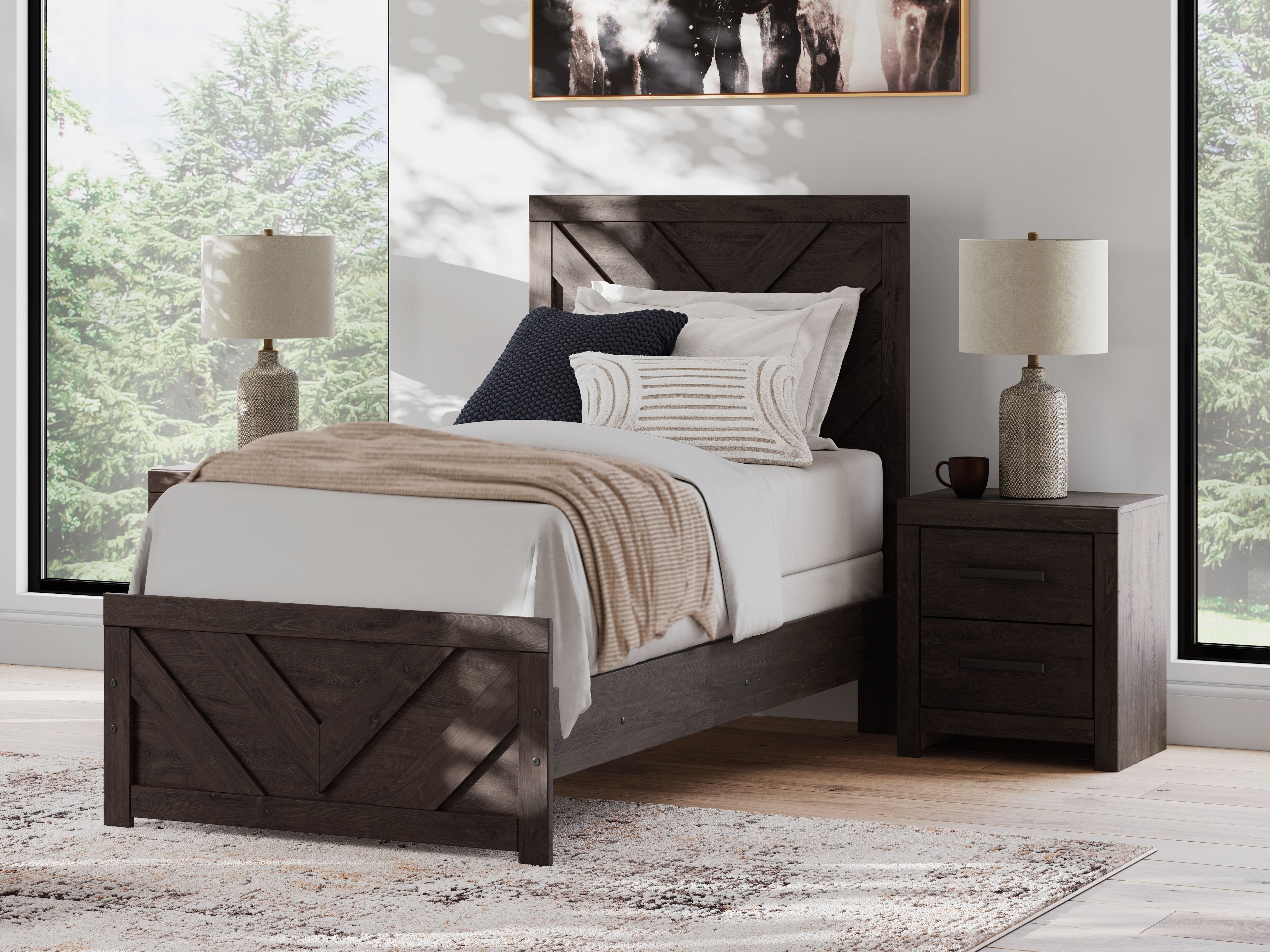 Panel bed with dark gray chevron headboard, white bedding and striped blanket