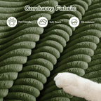 Green corduroy fabric upholstery with ridged texture and soft pile