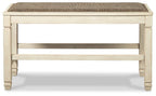 Light beige wooden counter bench with upholstered top and lower support frame