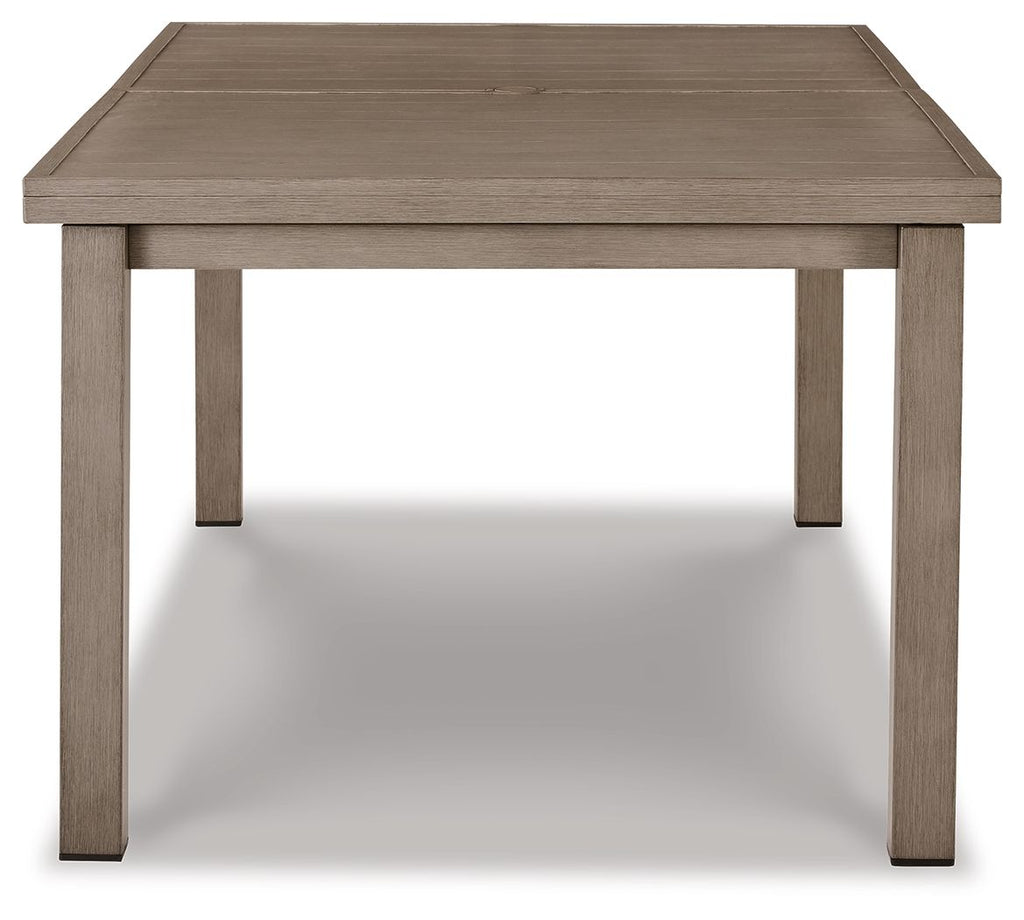Rectangular dining table with beige tabletop and tapered leg supports