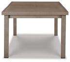 Rectangular dining table with beige tabletop and tapered leg supports