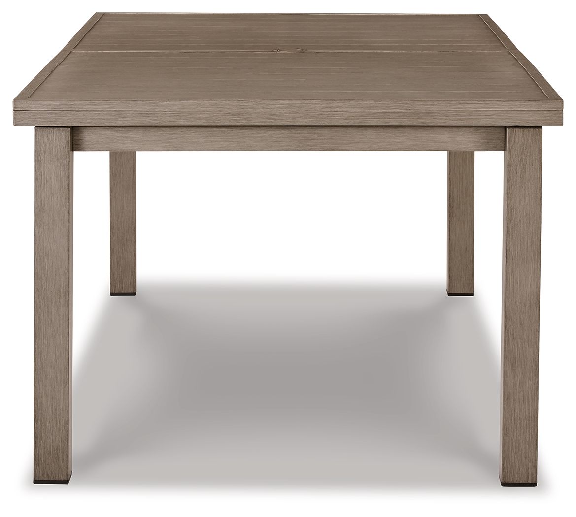 Rectangular dining table with beige tabletop and tapered leg supports