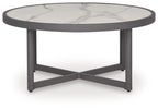 Gray round table with white marble-look top and crossed base support