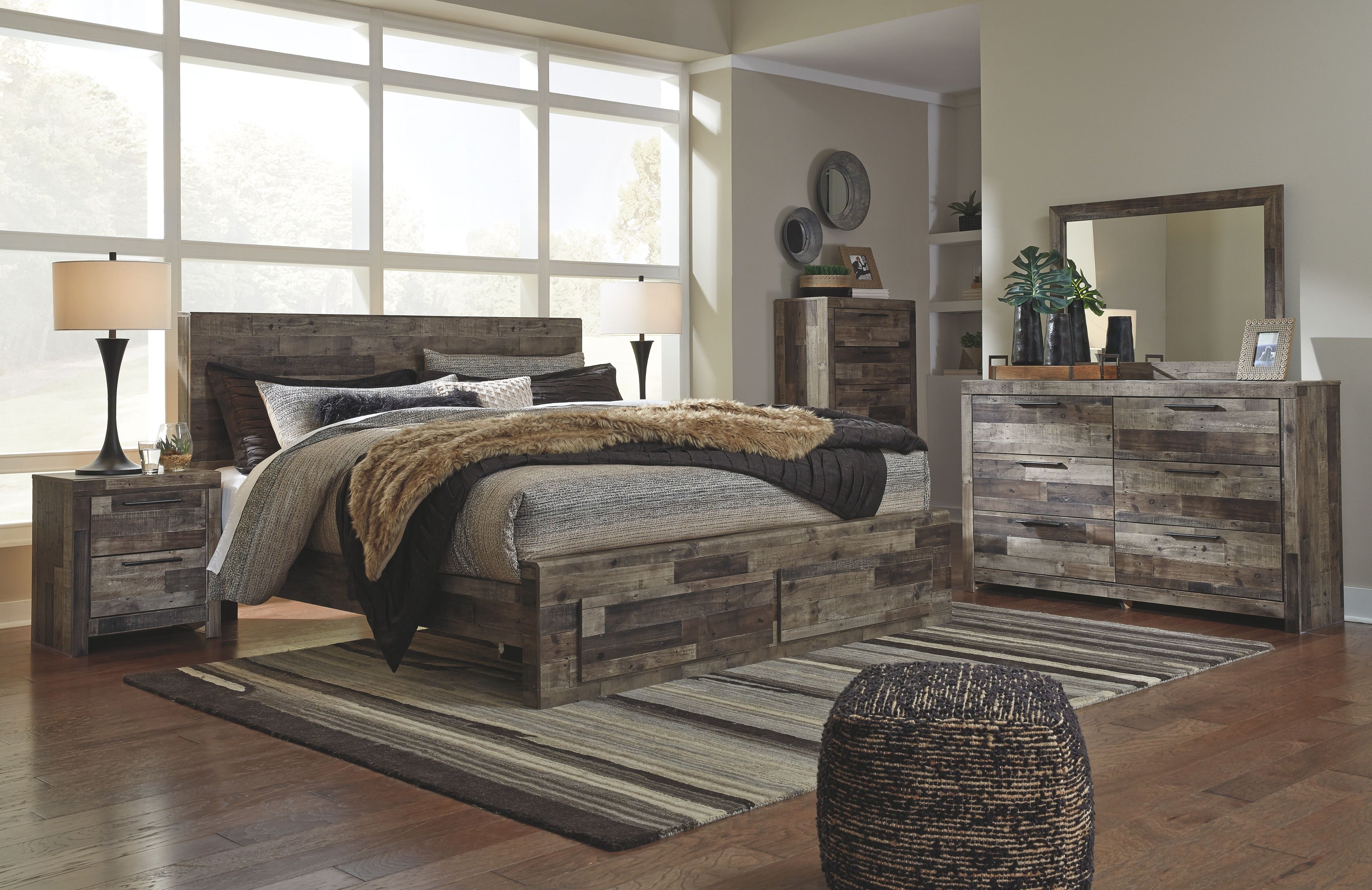 Panel bedroom set with panel bed, nightstand, and dresser with mirror in rustic gray wood.