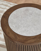 Round tabletop detail with gray surface and dark brown curved wooden rim.
