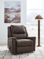 Dark gray faux-leather rocker recliner with cushioned seat and tall padded back