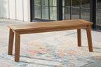 Light brown wooden bench with long slatted seat and tapered legs