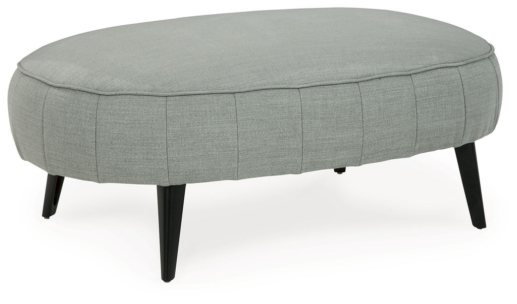 Gray upholstered ottoman with stitched skirt and tapered legs
