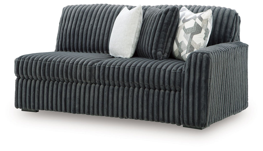 Gunmetal ribbed sofa with square armrest and two decorative pillows