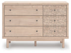 Wood dresser with three drawers and three floral-pattern cabinet drawers, dark knobs