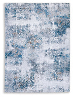 Abstract blue and white 5x7 area rug with distressed pattern