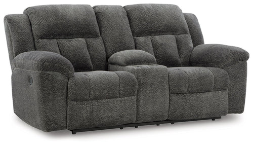 Dark gray double reclining loveseat with padded arms and tufted seat and back cushions
