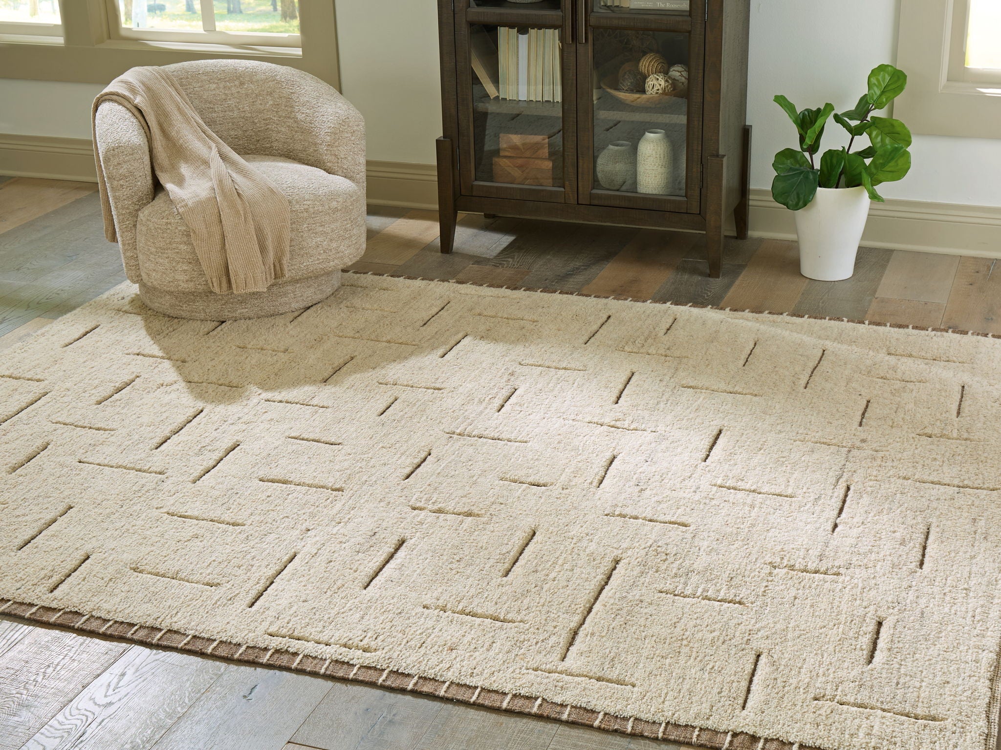 Beige rug with abstract lines, short pile and flat woven surface