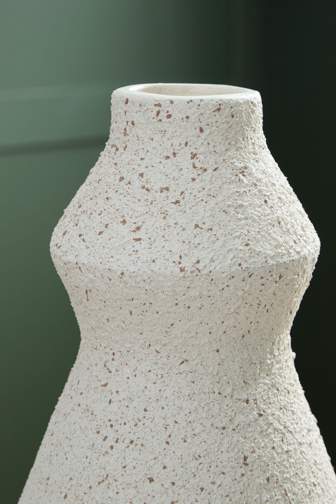 Dawthorne vase in speckled white with rounded shoulders and tapered neck
