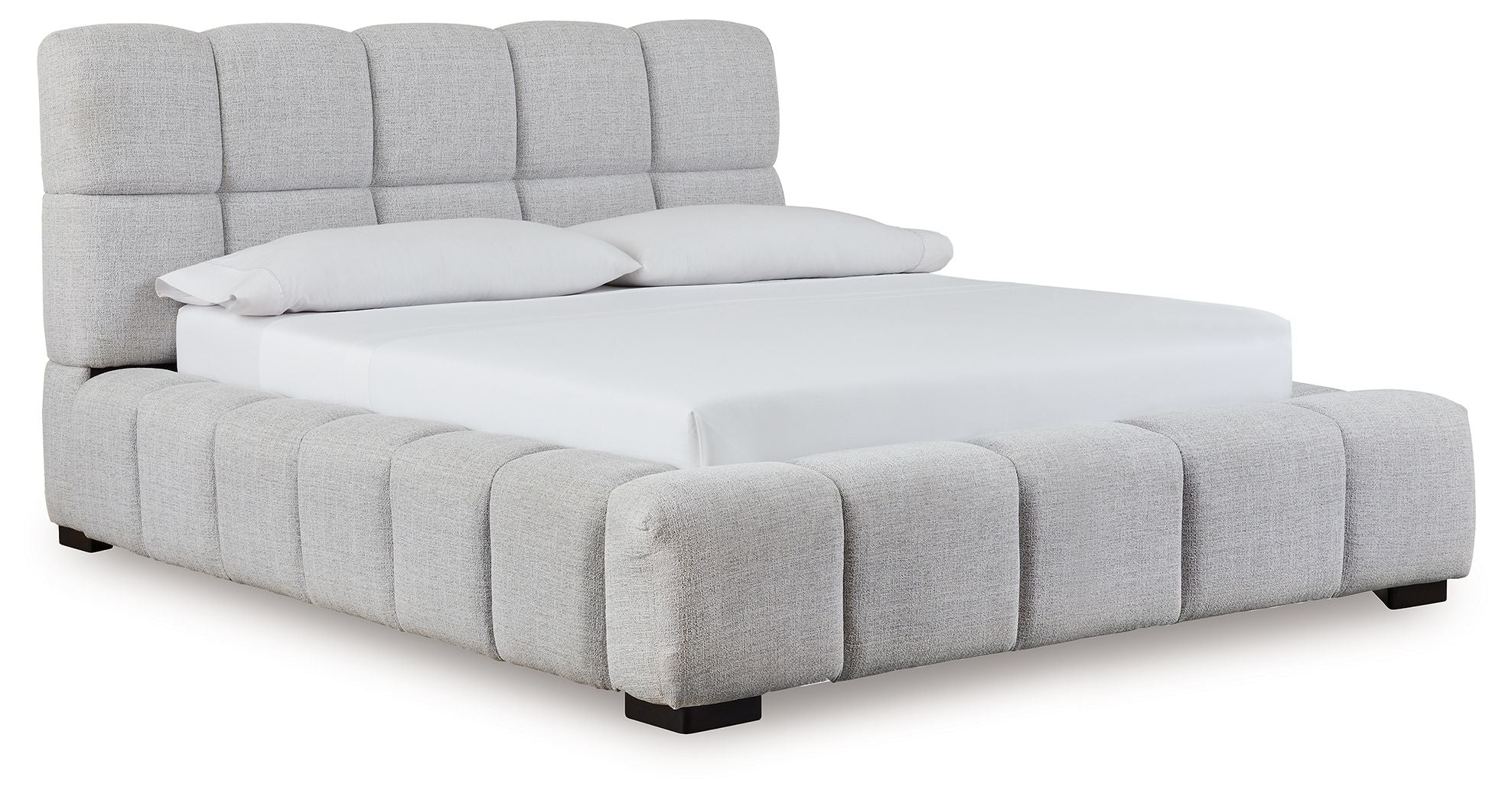 Gray upholstered bed with tufted headboard and padded side rails