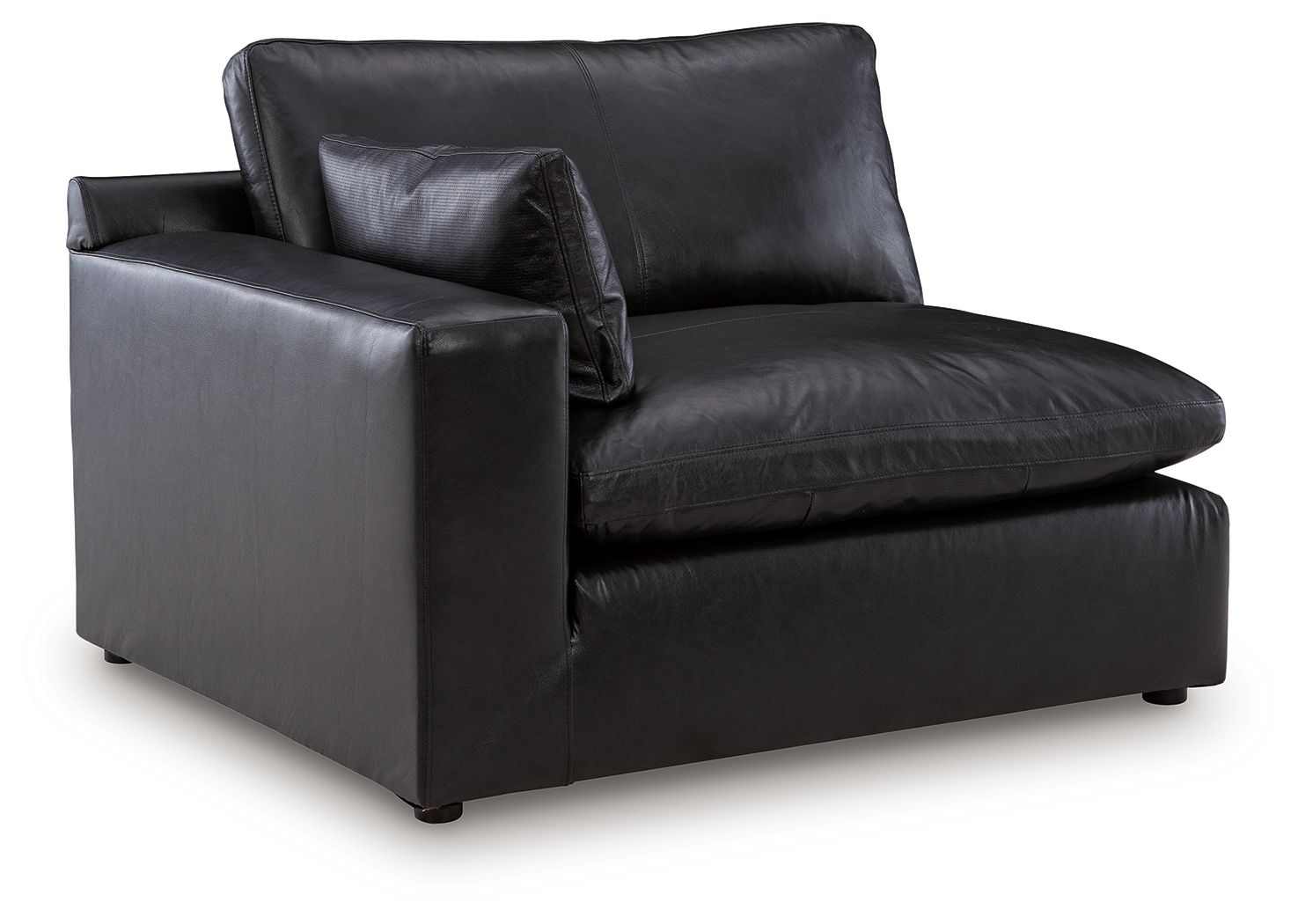 Black leather-look corner chair with tufted seat and back, wide arms, square base.