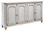 Antique white accent cabinet with four panel doors and metal knobs