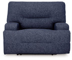 Wide seat power recliner in navy blue, front view with rounded armrests.