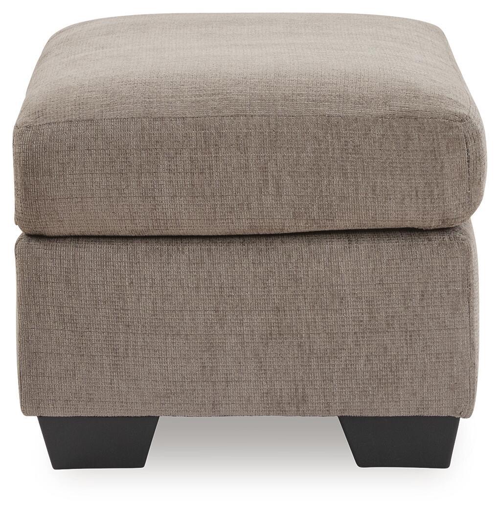Beige fabric ottoman with cushioned lid and dark tapered block legs