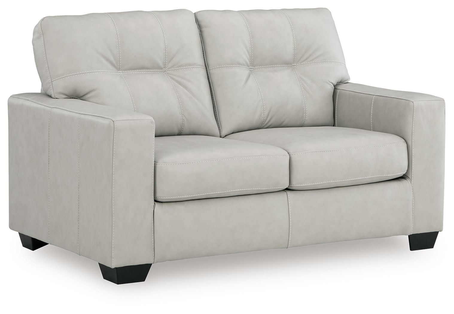 Light beige leather-look loveseat with tufted back, wide arms, and two seat cushions