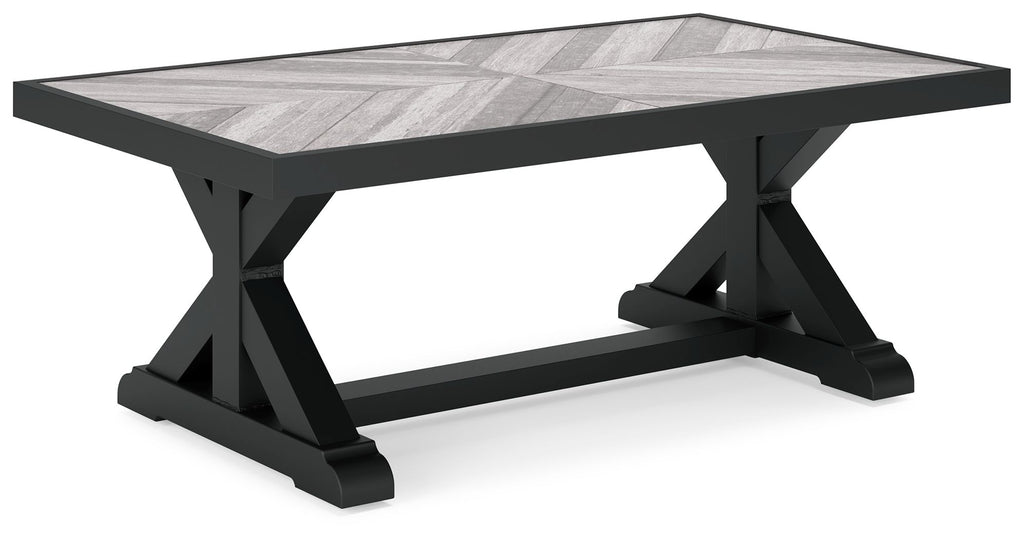 Rectangular cocktail table with black legs and light gray rectangular tabletop