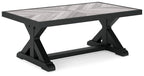 Rectangular cocktail table with black legs and light gray rectangular tabletop