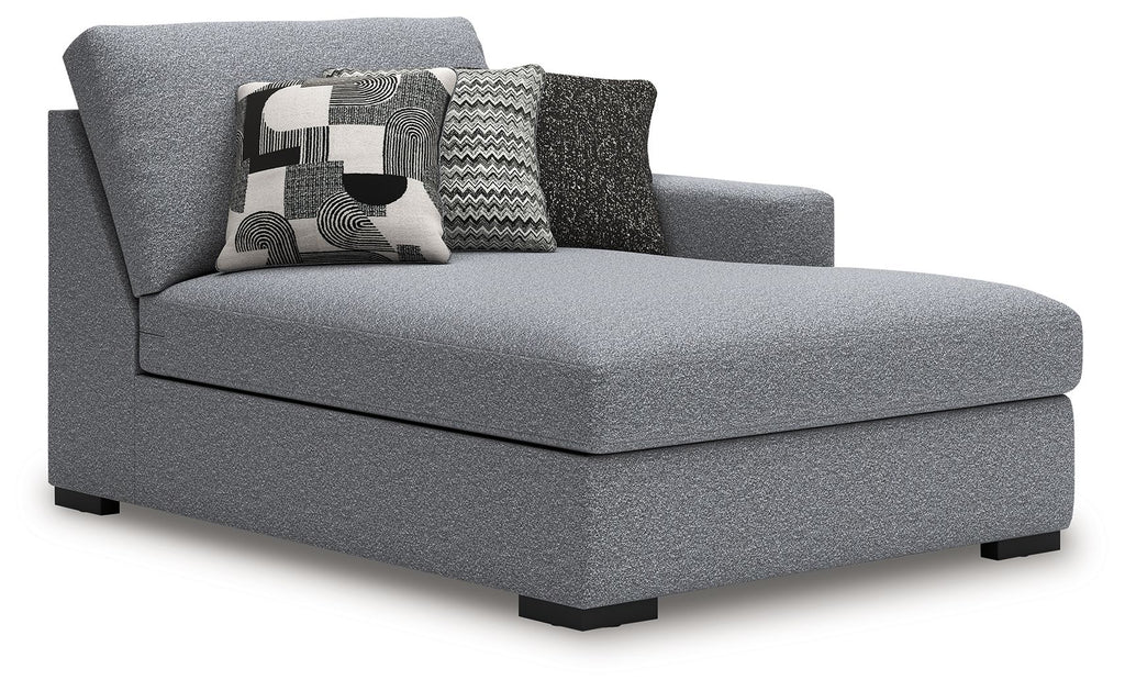 Gray RAF corner chaise with wide seat cushion, tall back, and patterned throw pillows
