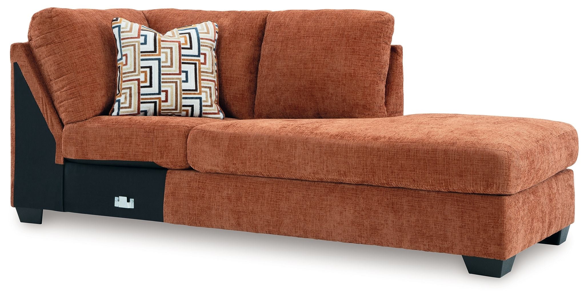 Spice orange-brown corner chaise with upholstered arms and patterned accent pillow