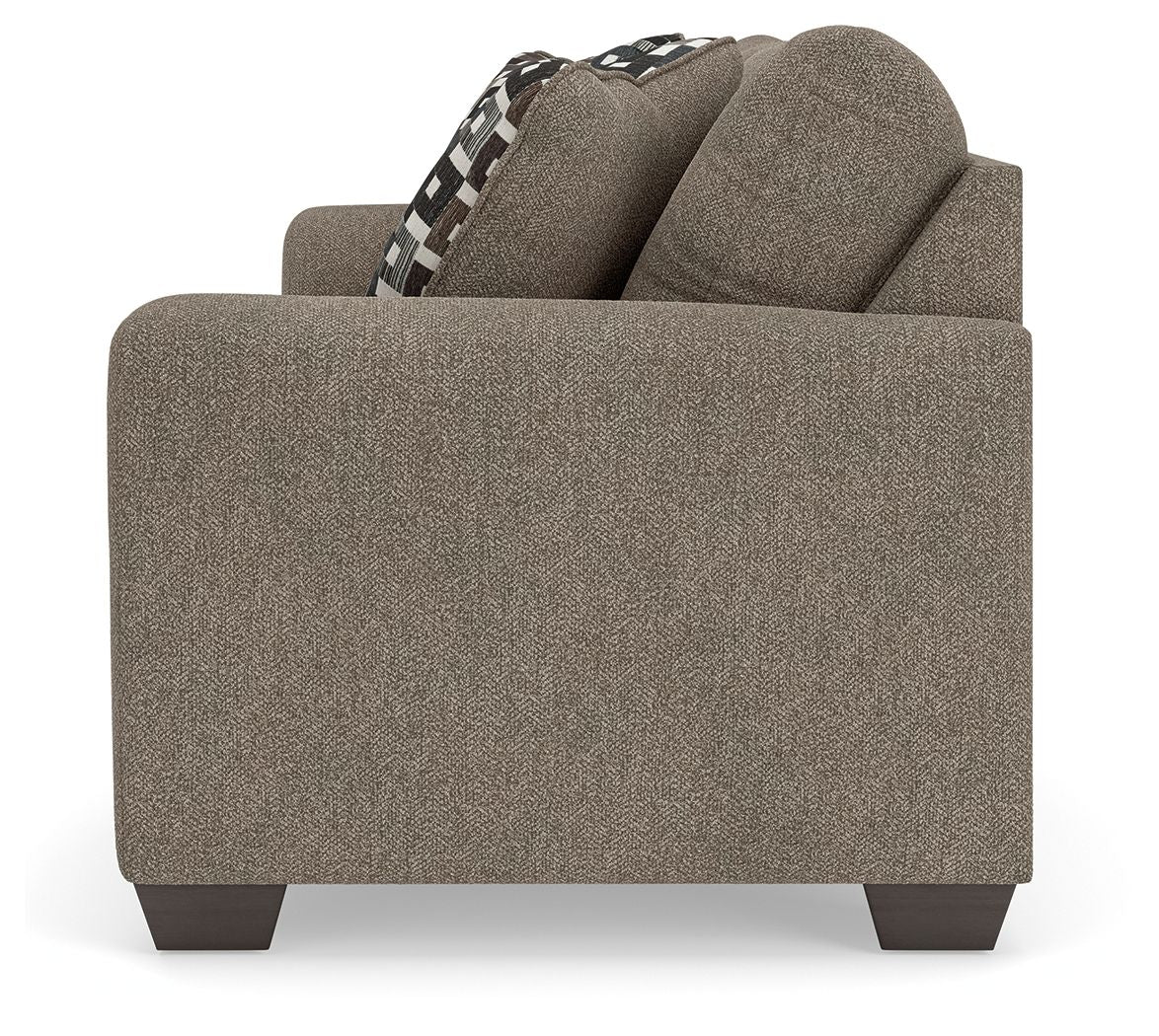 Beige fabric sofa end with armrest and check-pattern throw pillow