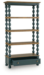 Blue bookcase with brown shelves, turned posts, and drawer at bottom; open front frame.