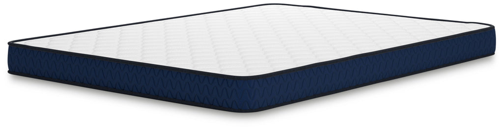 Firm mattress with white quilted top and dark blue side border