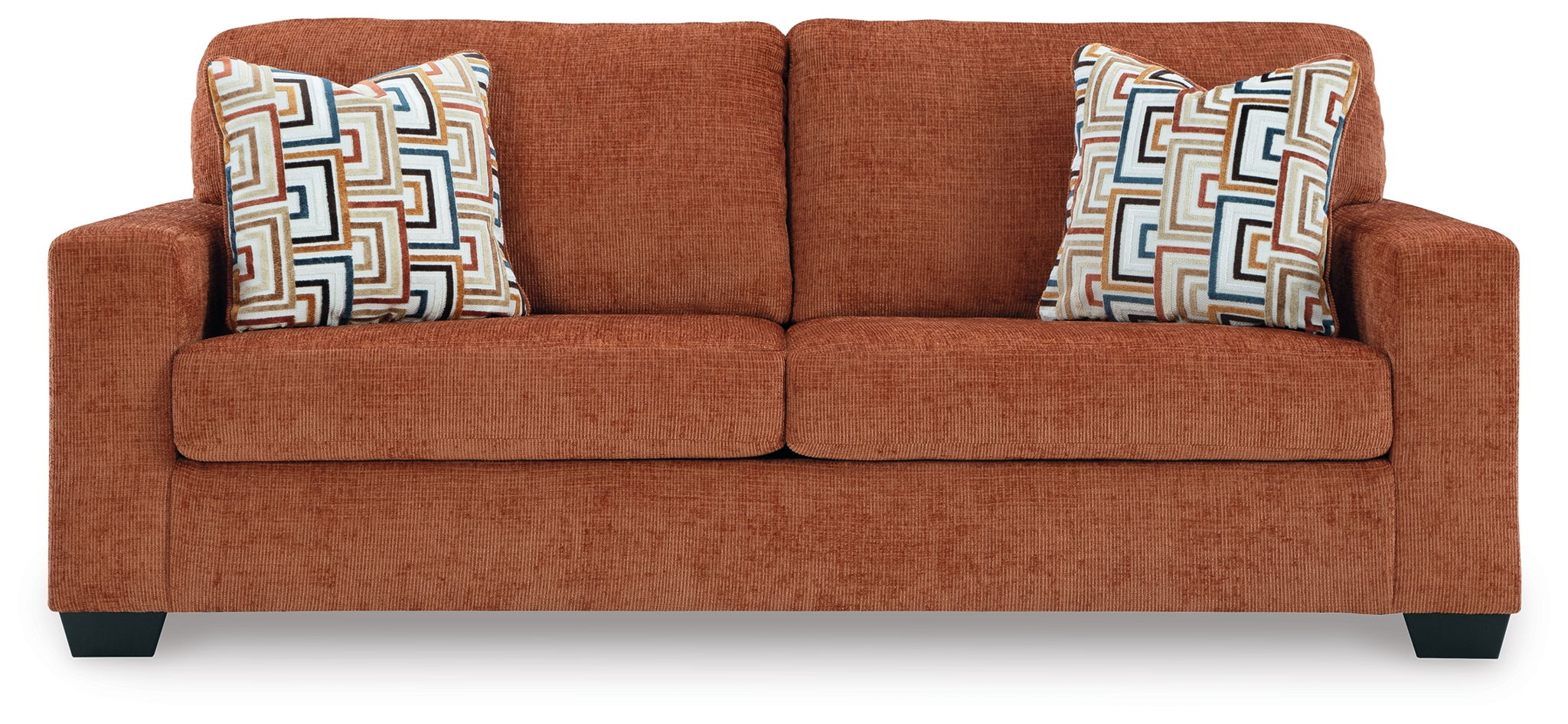 Burnt orange-brown upholstered sofa with centered seat cushion and two throw pillows.