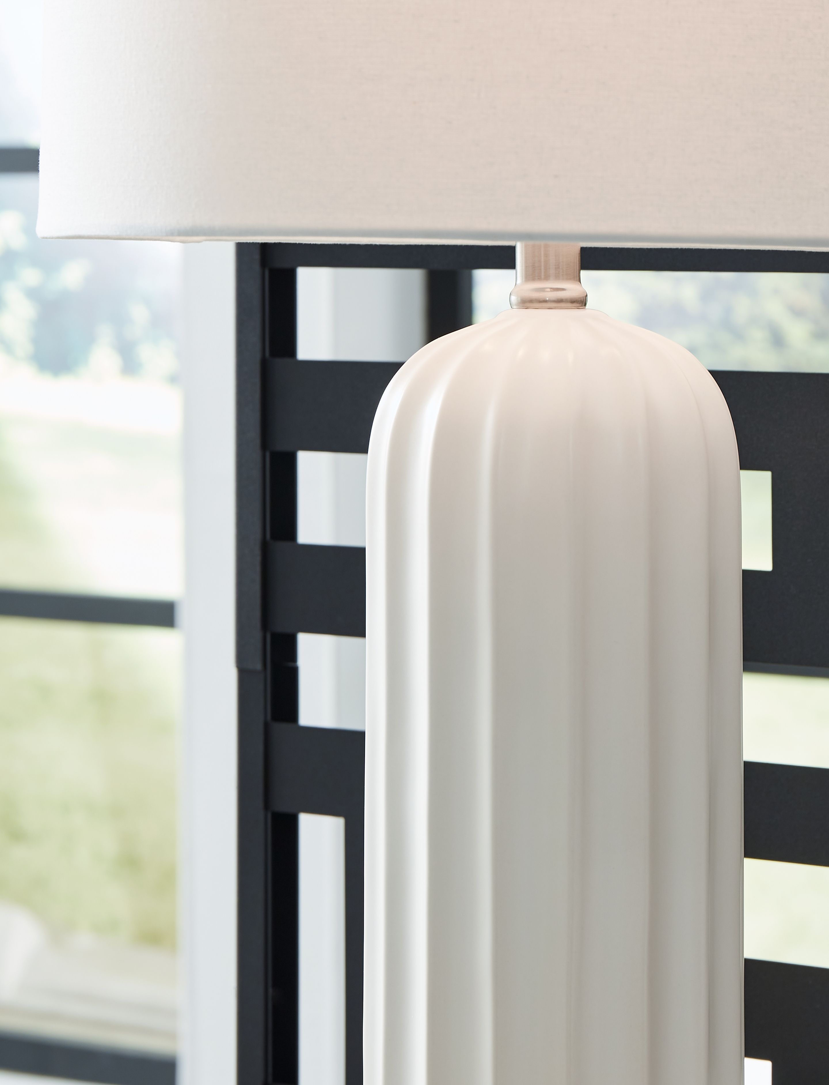 Ceramic table lamp with white ribbed body and square fabric shade