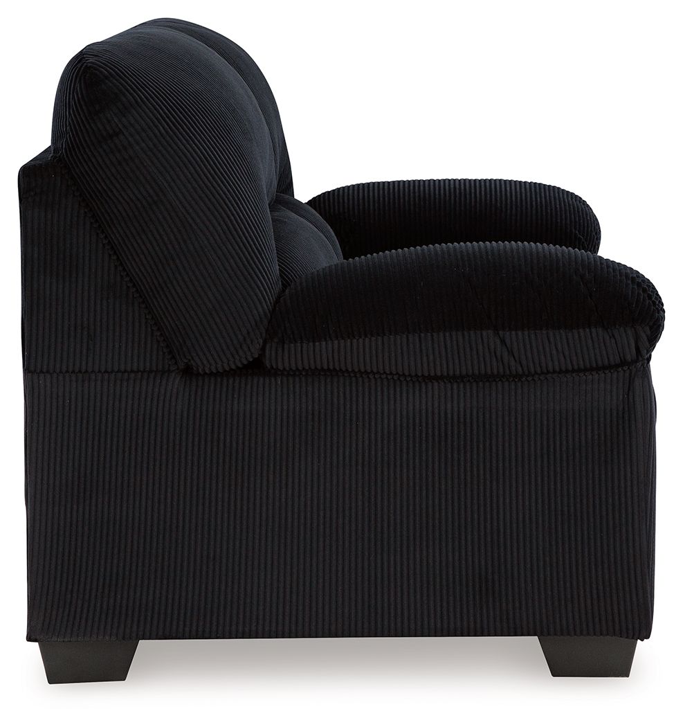 Black corduroy loveseat with rolled armrest, padded back, and straight seat