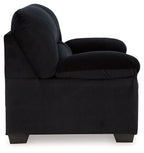 Black corduroy loveseat with rolled armrest, padded back, and straight seat