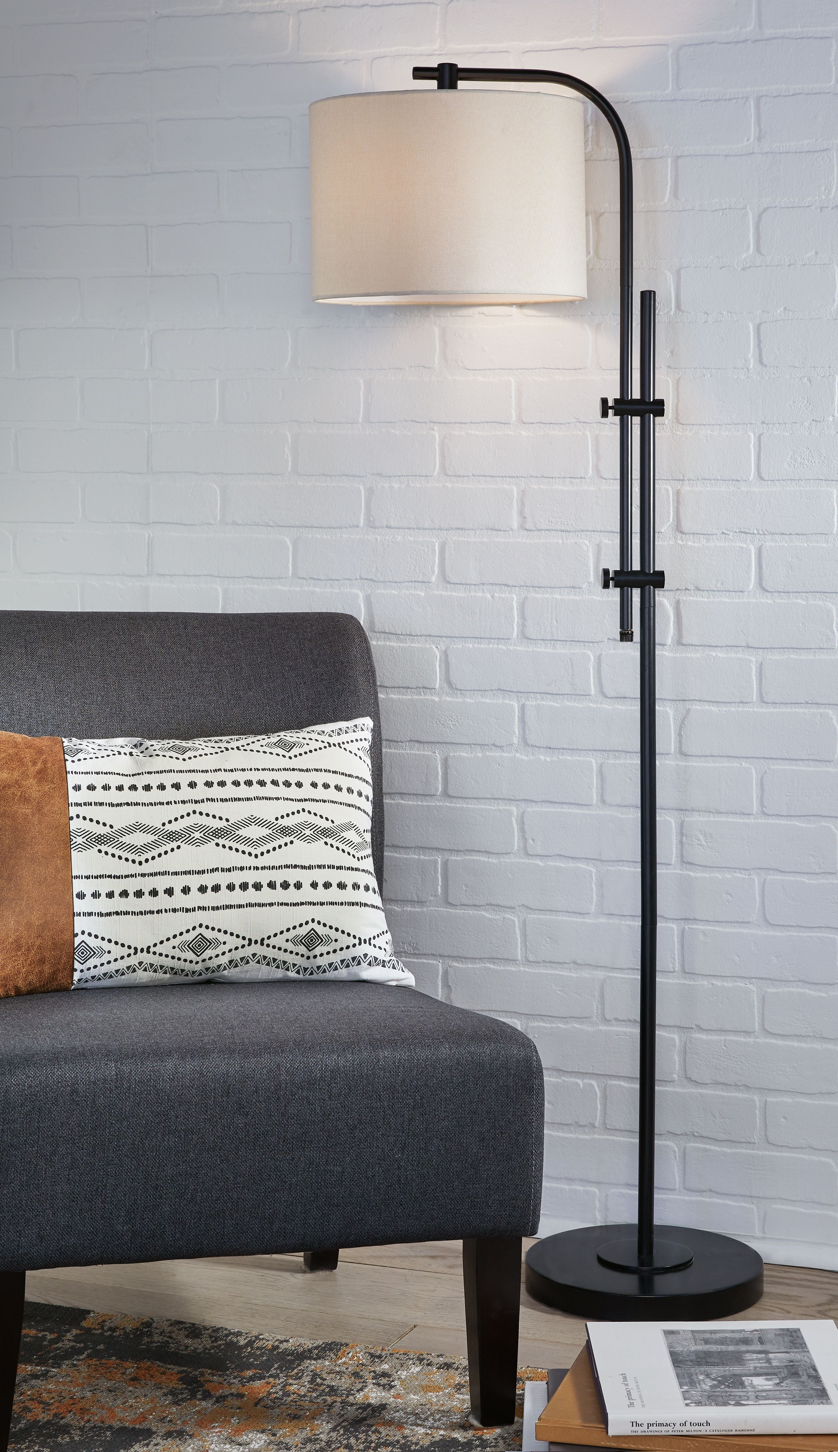 Black metal floor lamp with rectangular cream shade and circular base