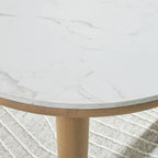 Edge of round dining table: light gray marble-look surface with light brown wooden rim