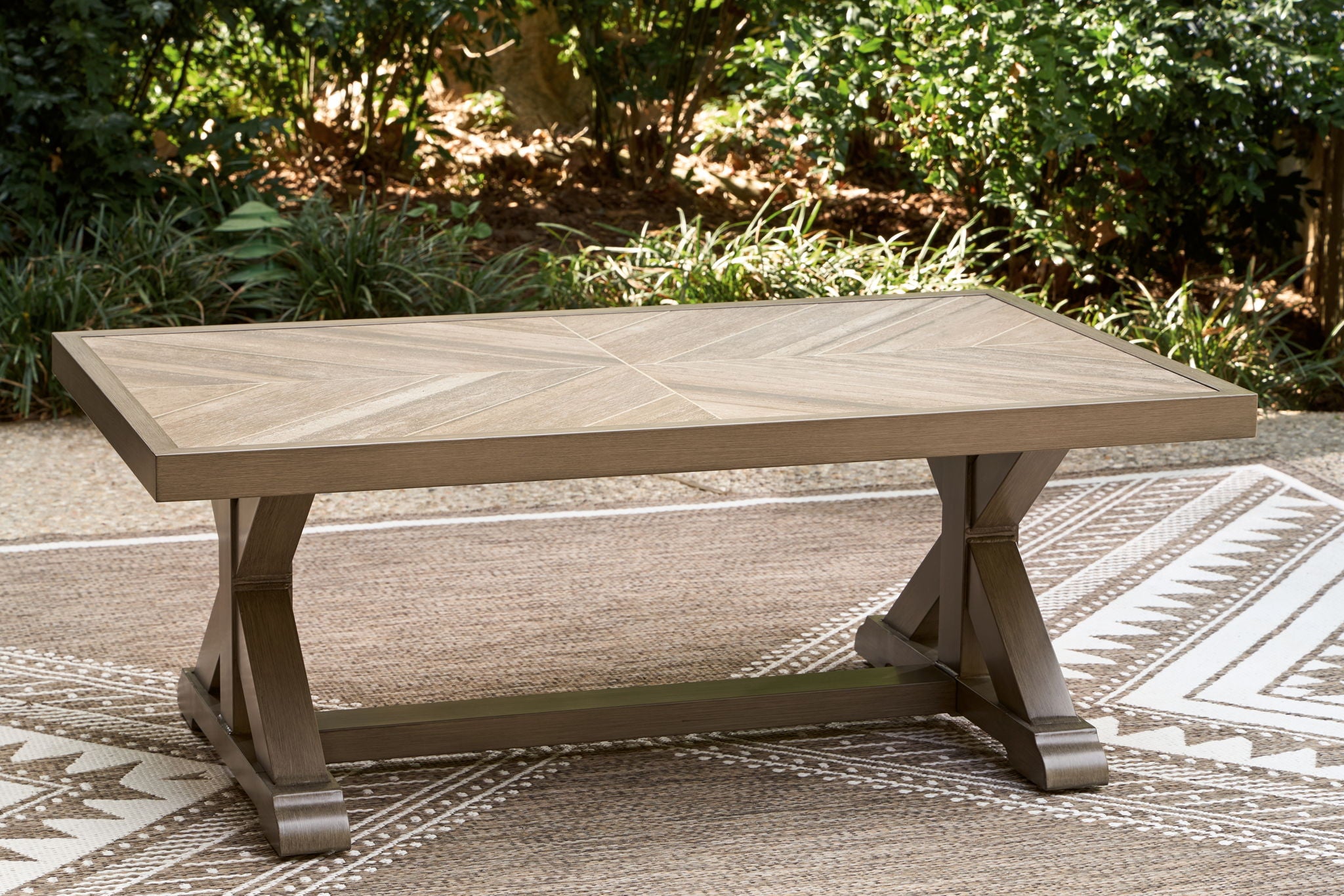 Rectangular cocktail table with light beige wood-grain top and sturdy tapered legs